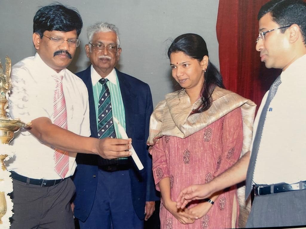 Dr. Patta Radhakrishna with MP Kanimozhi at an event


